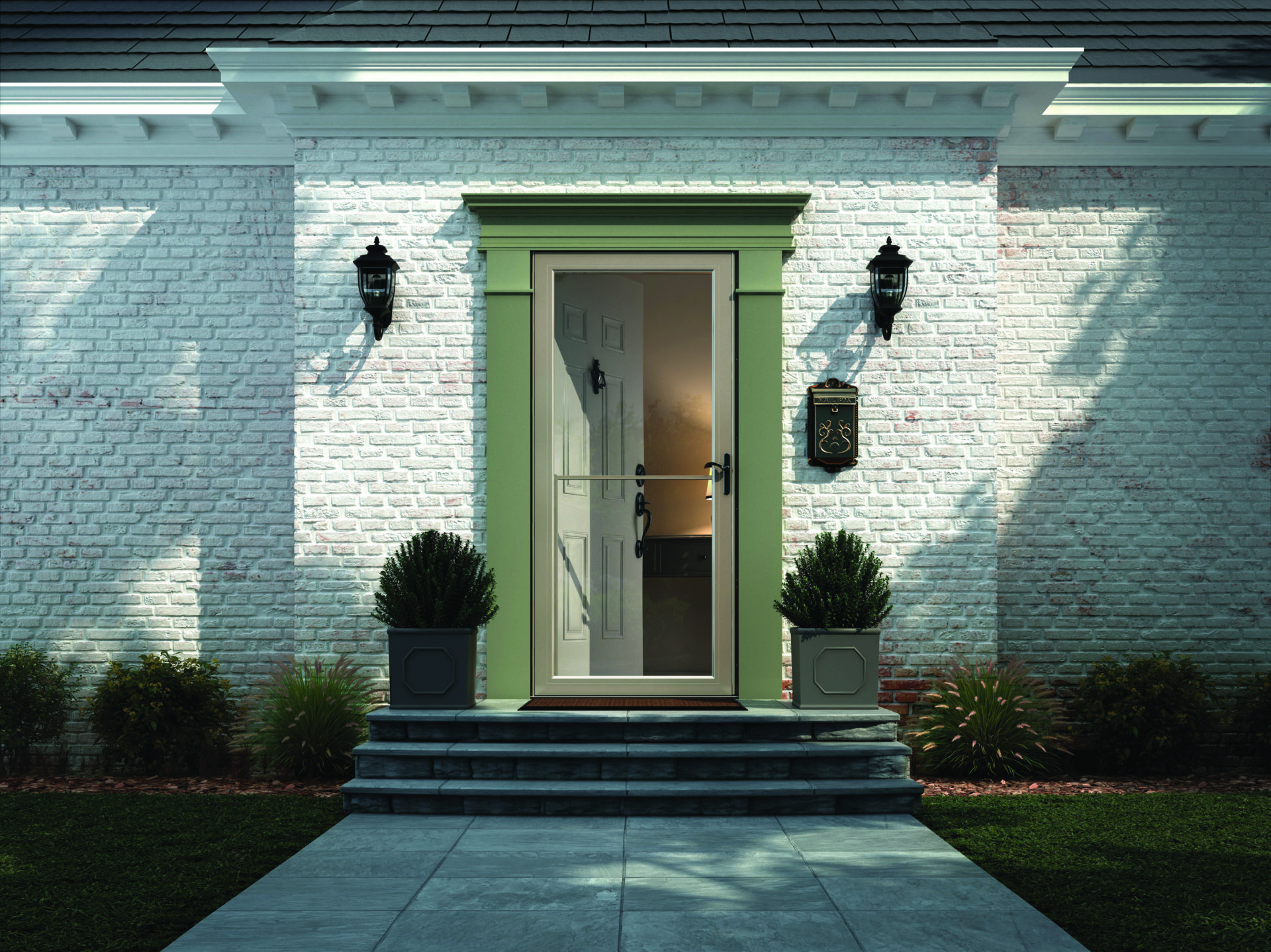 A fullview glass front door with green moulding on a white brick home