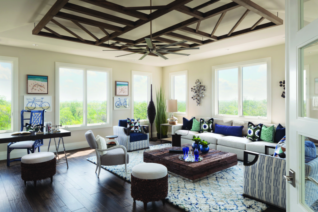 Modern eclectic coastal living room with ornate wood ceiling beams and Andersen 400 series casement picture windows