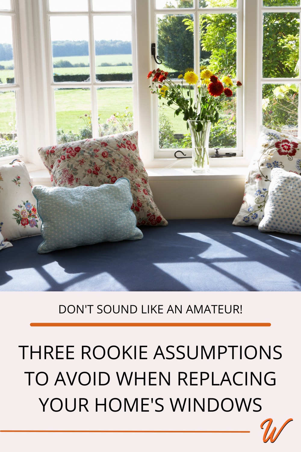 Blue seating bench under a window with floral pillows and flowers in a vase captioned with "Dont' sound like an amateur: three rookie assumptions to avoid when replacing your home's windows"