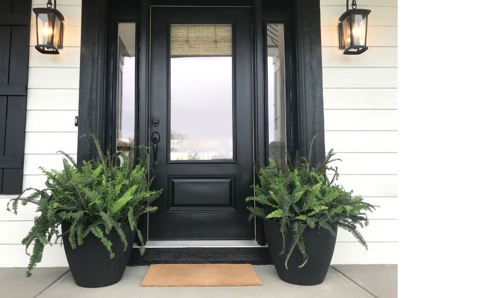 Black front door with black sidelights with no grilles