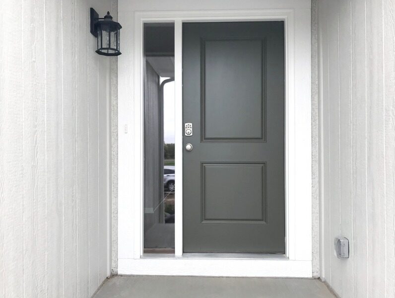 Black front door featuring one sidelight