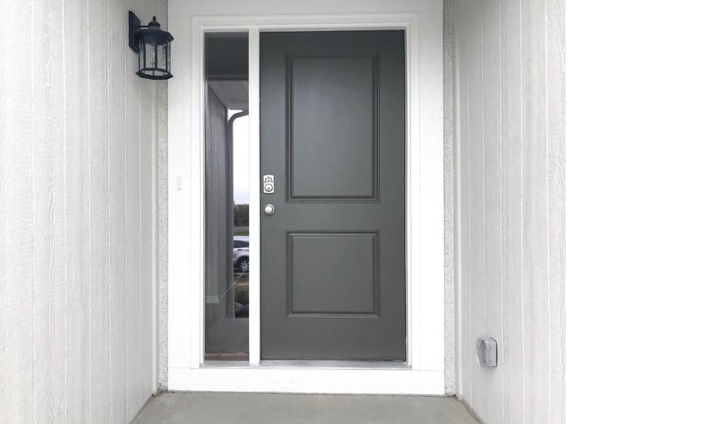 Black front door featuring one sidelight