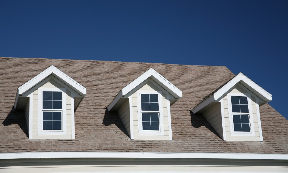 Image of a roof with three dormer windows