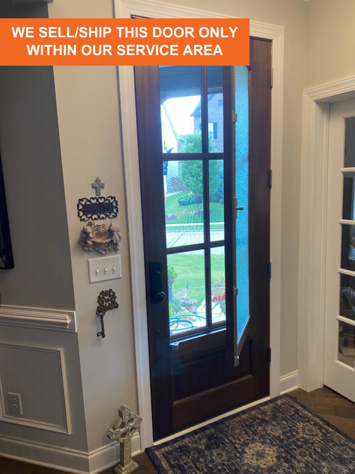 The DSA Breezeport door from inside a home with the venting window partially open. Screens between the six-lite portion of the door keep bugs out.