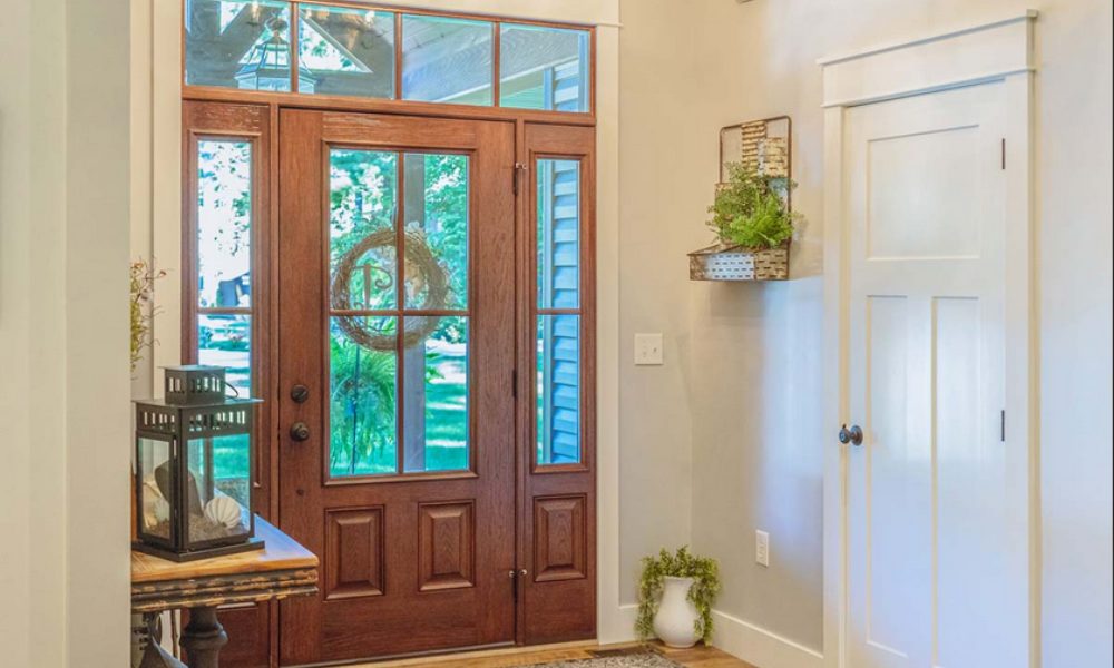 Entry foyer of a home with a wood grain look fiberglass front door by ProVia