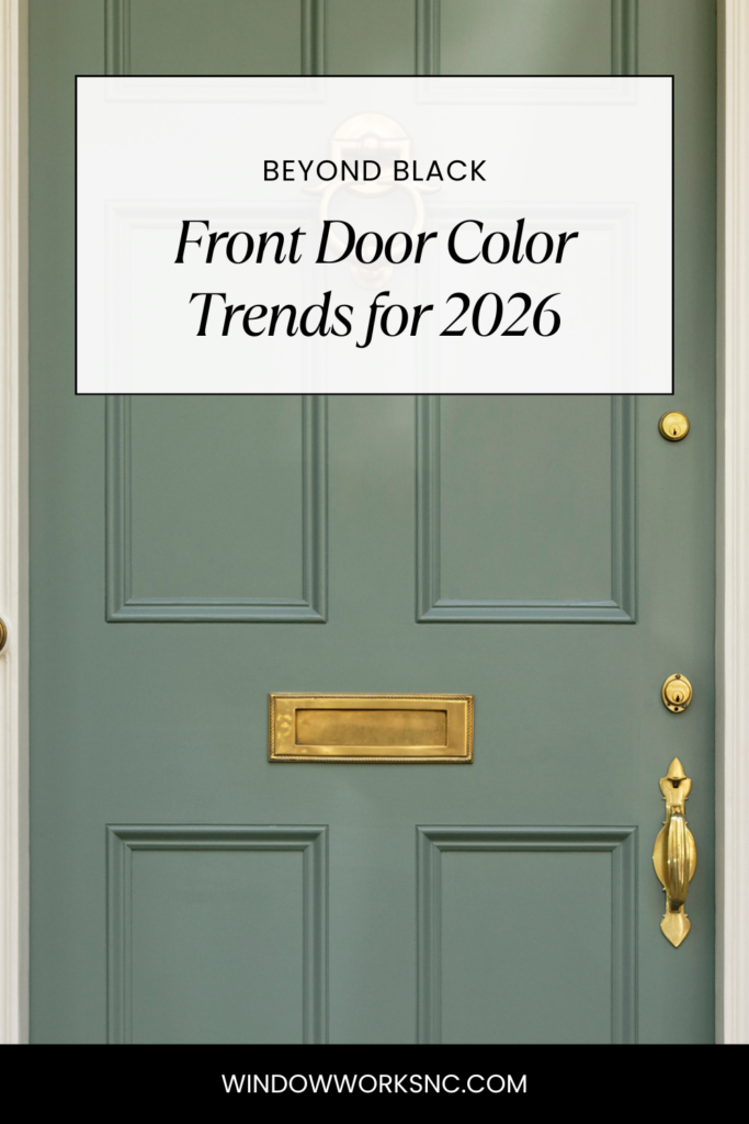A muted green front door with a brass mail slot and door knocker. Text above reads Beyond Black: Front Door Color Trends for 2026, highlighting the latest front door color trends. Website windowworksnc.com appears at the bottom.