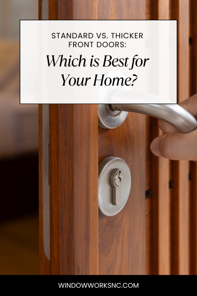 A hand opens a wooden front door with a metal handle and keyhole. Text overlay: Standard vs. Thicker Front Doors—Which is Best for Your Home? Discover the best front doors at windowworksnc.com.