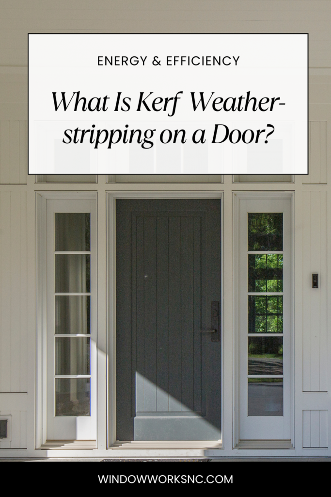 A gray front door surrounded by sidelites and a transom on a front porch