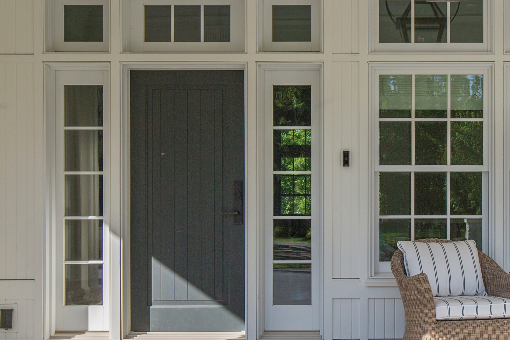 A gray front door with sidelites and a transom in Chapel Hill, NC